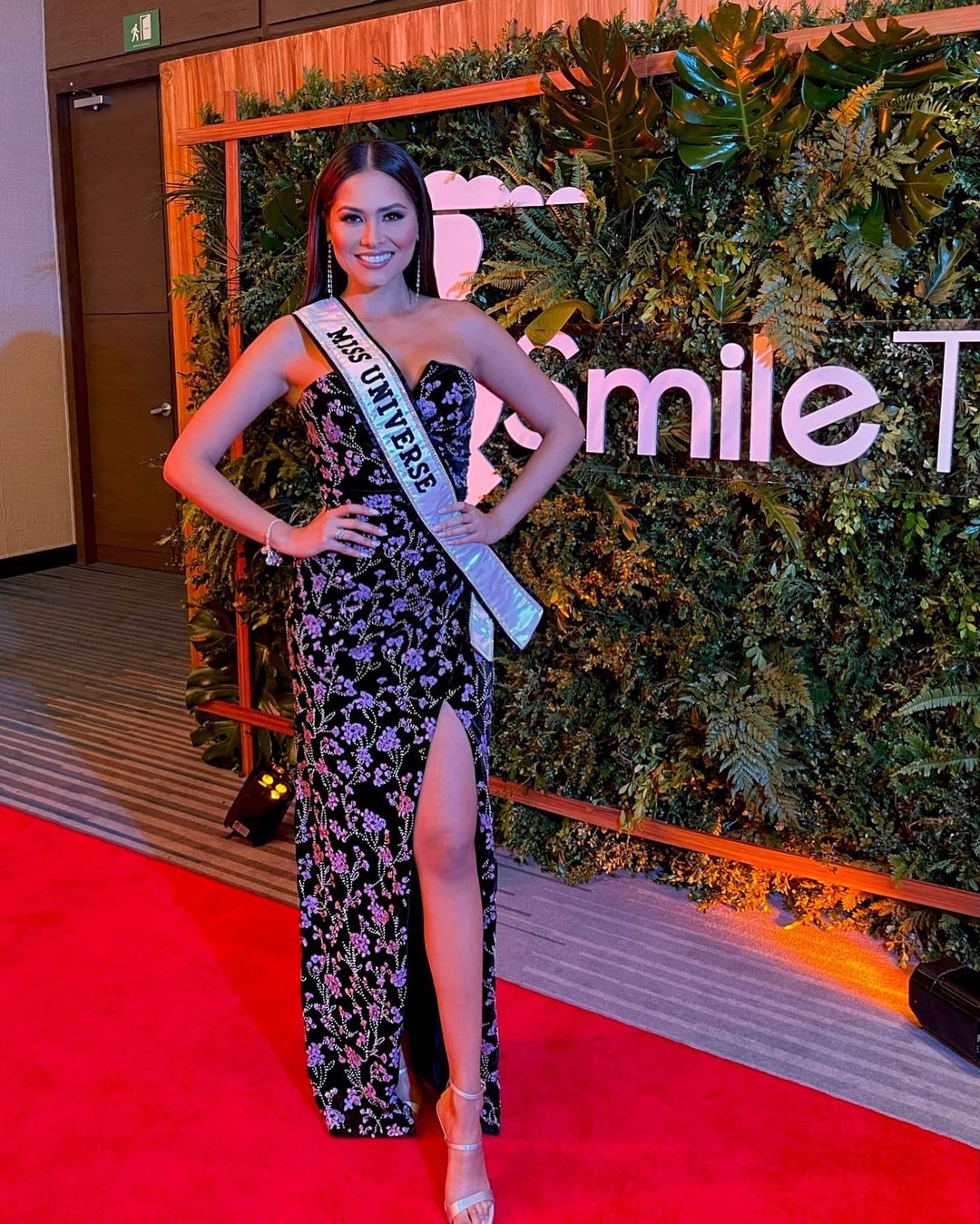 Andrea Meza in a floral THEIACouture gown 