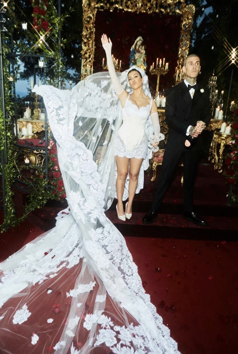 Kourtney Kardashian Barker is one famous bride who chose to wear a short dress to her lavish, Italian wedding to Blink-182 drummer, Travis Barker.
