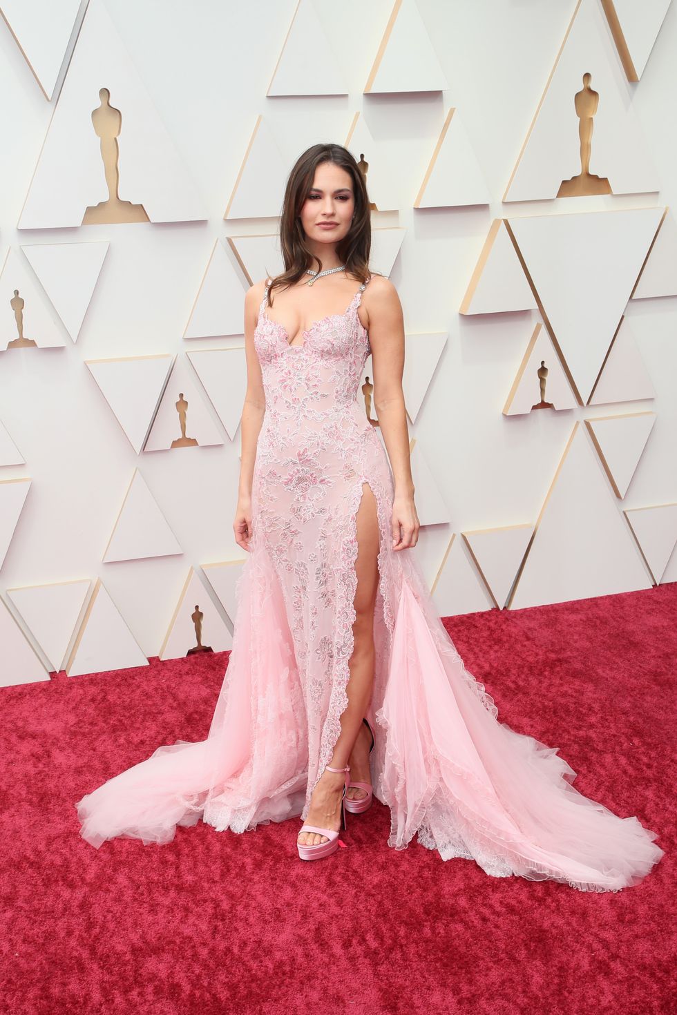 Lily James on the 2022 oscars red carpet DAVID LIVINGSTONGETTY IMAGES Wearing Atelier Versace.