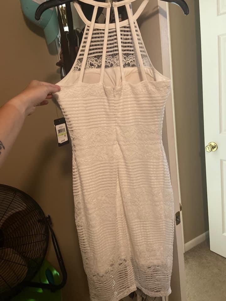 The brand is guess, ivory cocktail dress. Very pretty. Size 4 White A-line Dress on Queenly
