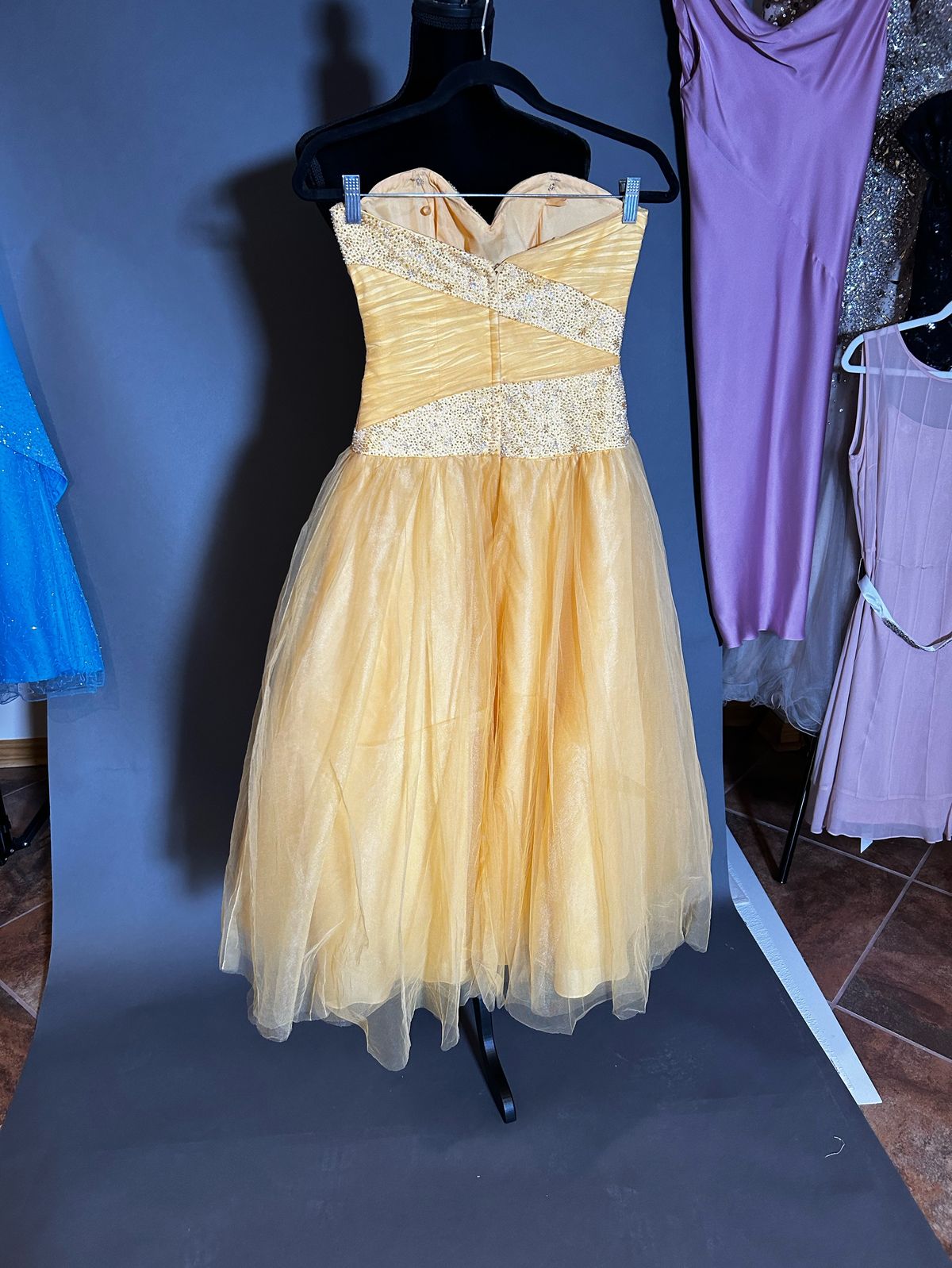 Size 2 Strapless Yellow Ball Gown on Queenly